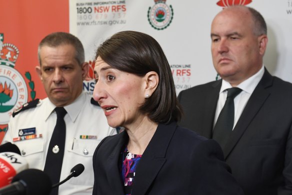 David Elliot, at right, during a media briefing on the bushfires with Rob Rogers and Premier Gladys Berejikilian last November. 