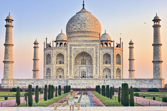 The writer’s mother alone on ‘the Princess Diana bench’ at the Taj Mahal.