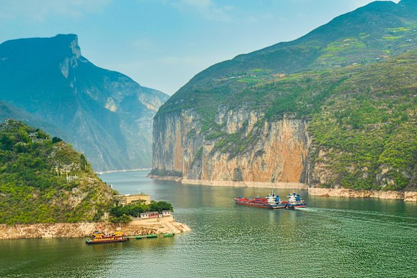 Cruising past the commercial traffic in the Qutang Gorge on China’s Yangtze River.