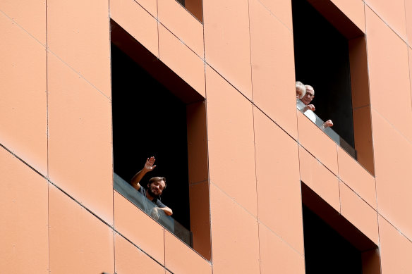 Quarantined hotel quests on the balcony of the Peppers on Waymouth Hotel in Adelaide.