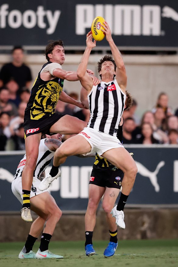 Brody Mihocek marks against Richmond in the practice game.