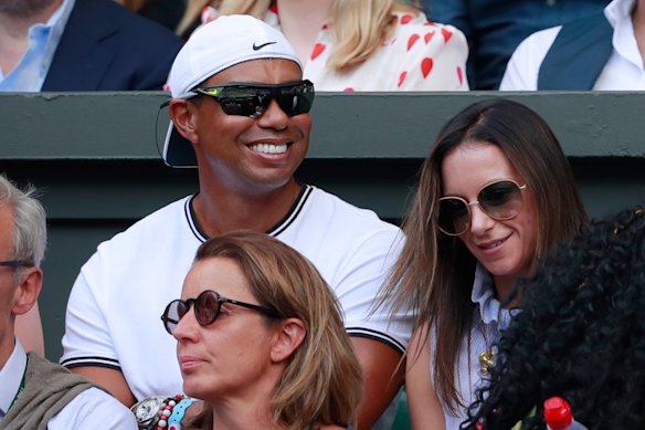 Tiger Woods sits in Williams' player box during this year's Wimbledon singles final.