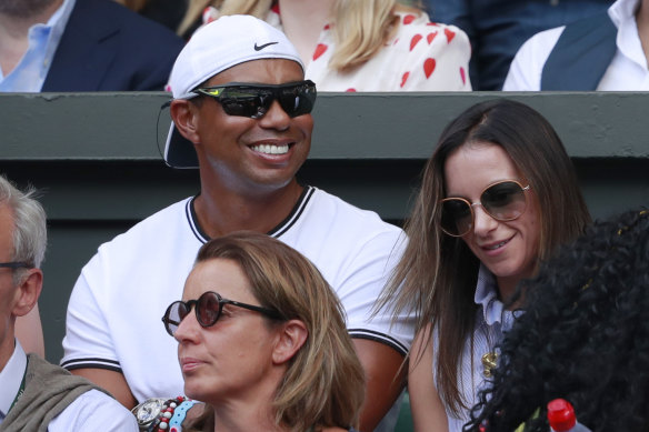 Tiger Woods sits in Williams' player box during this year's Wimbledon singles final.