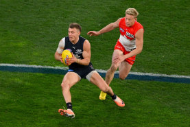 Patrick Cripps attemps to evade Isaac Heeney during the elimination final last season.