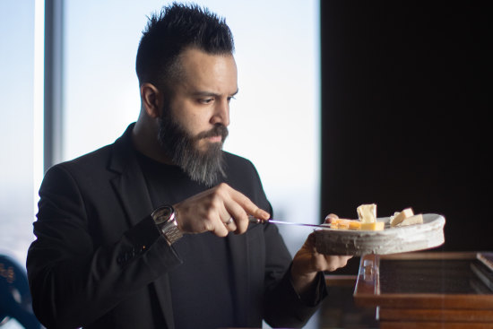 Rajnor Soin pictured with the all-Australian cheese trolley at Vue de Monde.