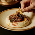 Hummus topped with Fraser Isle spanner crab and Mooloolaba prawns.