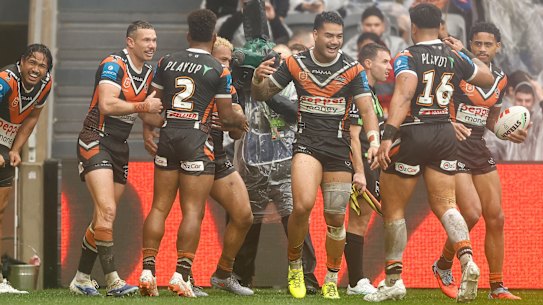 Wests Tigers players celebrate.