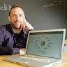 Jimmy Wales in 2006 with an early iteration of Wikipedia.