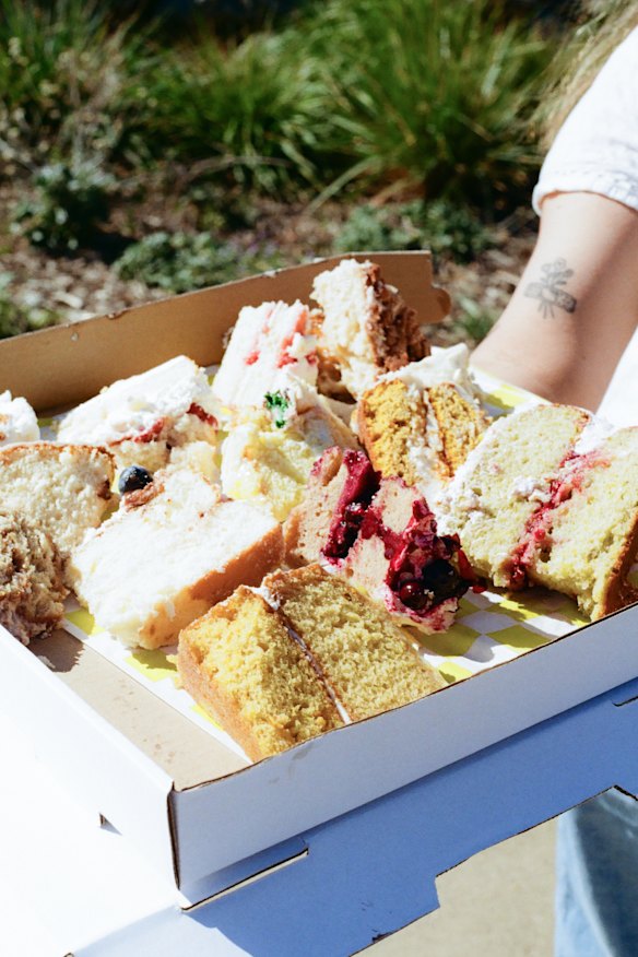 Attendees go around the tables, filling cake boxes with different slices.