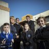 Alphington Grammar School principal Dr Vivianne Nikou stands with students Miles, Isabella, Zoe, Ethan and Nikoletta at the school gates.