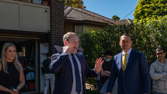 Auctioneer Edward Riley prepares to sell the Artarmon home. 