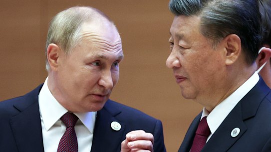 Vladimir Putin speaks to President Xi in Shanghai in September.