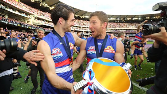 Easton Wood (left) and Matthew Boyd celebrate the Western Bulldogs’ fairytale 2016 premiership, from seventh place.