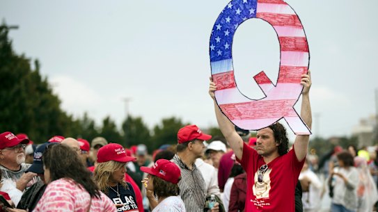 A QAnon sign at a Donald Trump rally. Believers say the US President will overcome the shadowy powers that control the country.