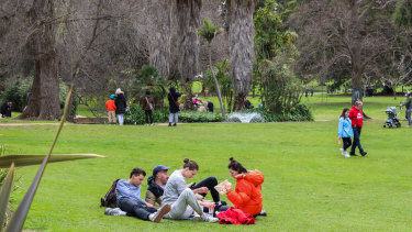People are seen walking and having picnics at Treasury Gardens on Sunday.