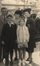 Millie Phillips with family on the ship, 1938.
