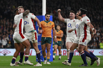 Englandâ€™s Freddie Steward, second left, celebrates after scoring the opening try.