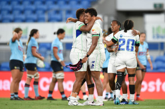 Vika Matarugu and Akosita Ravato celebrate victory over the Waratahs.