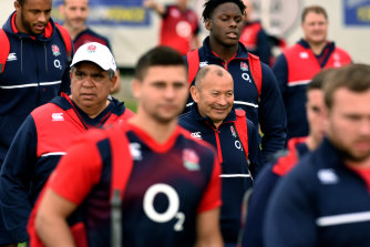 Eddie Jones walking with the England squad in 2016, which included Glen Ella (left).