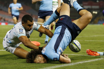 Waratahs winger Mark Nawaqanitawase left the field injured after crashing into the turf head first while scoring a try.