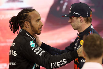Lewis Hamilton, left, congratulates Max Verstappen, right, in Abu Dhabi.
