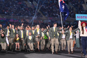 Eddie Ockenden and Rachael Grinham, flag bearers of Team Australia lead their team out during the Opening Ceremony of the Birmingham 2022 Commo<em></em>nwealth Games wearing uniforms by RM Williams.