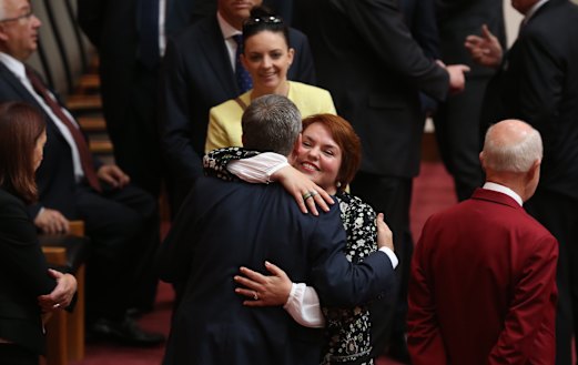 Kimberley Kitching is embraced by her friend, then opposition leader Bill Shorten, after her first speech in the senate at Parliament House in 2016. 