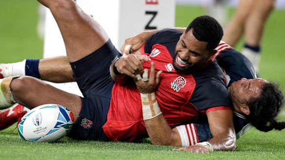 England's Joe Cokanasiga reacts after scoring a try.