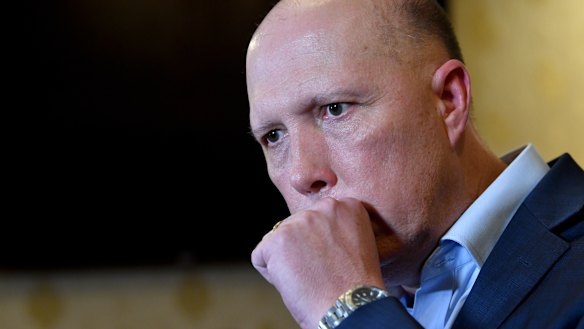 Home Affairs Minister Peter Dutton's positive test result for coronavirus sparked a dispute about the formal medical advice.