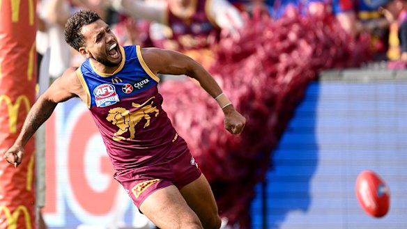 Callum Ah Chee of the Lions celebrates kicking a goal during the AFL grand final in 2024.