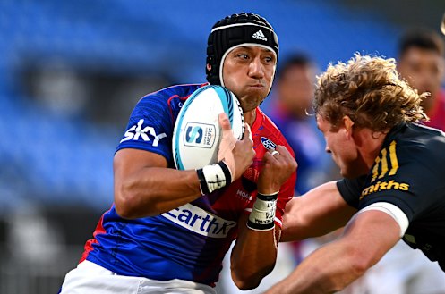 Moana Pasifika’s Christian Leali’ifano takes on the Hurricanes.