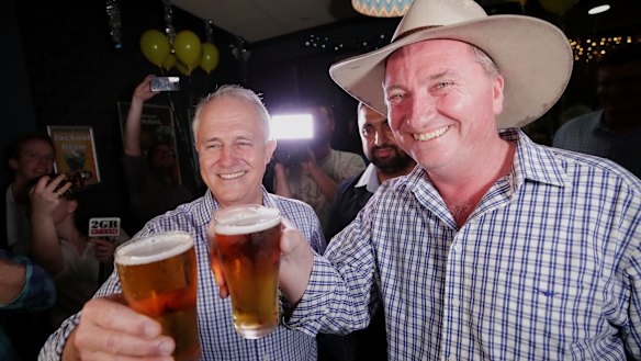 Prime Minister Malcolm Turnbull and New England candidate Barnaby Joyce celebrate at Barnaby Joyce's election night party at the Southgate Inn in Tamworth during the New England by-election on Saturday 2 December 2017.