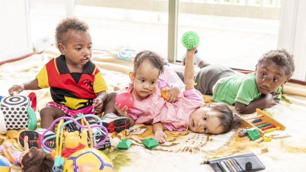 Nima and Dawa play with other children Ann and Jack at the Children First Foundation retreat.