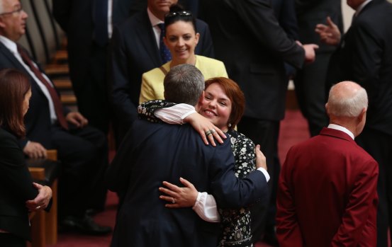 Kimberley Kitching is embraced by her friend, then opposition leader Bill Shorten, after her first speech in the senate at Parliament House in 2016. 