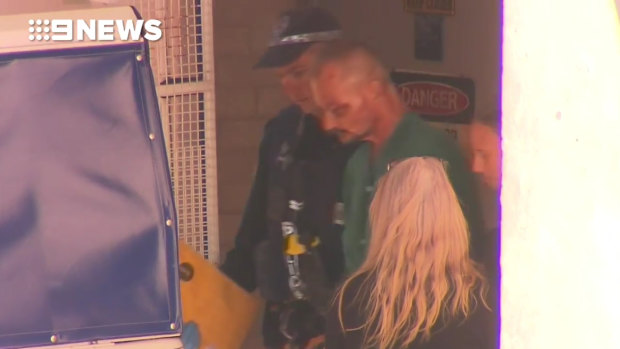 Accused Darwin shooter Ben Hoffmann is taken from hospital into custody.