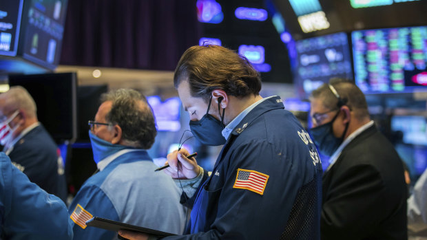 Traders on the floor of the New York Stock Exchange. There's concerns the market has climbed too high and left share prices too expensive.