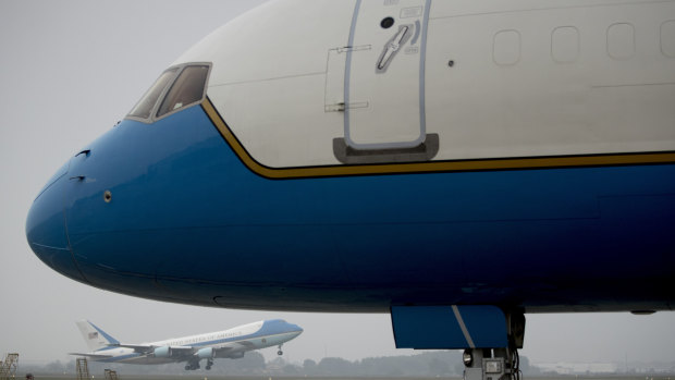 Secretary of State Mike Pompeo's plane in the foreground, and Trump's Air Force One behind, take off from Hanoi after the unsuccessful summit.