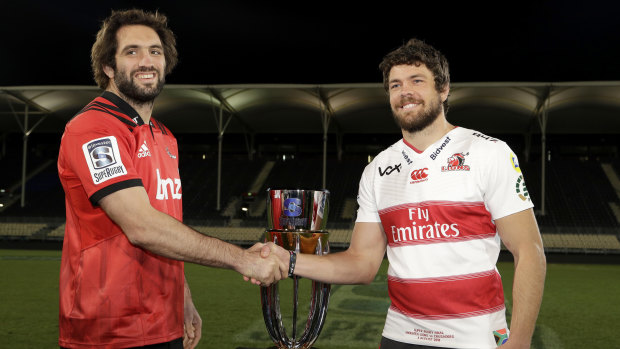 The prize: Crusaders captain Sam Whitelock and Lions counterpart Warren Whiteley with the Super Rugby trophy.