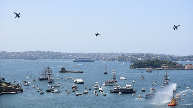 Aircraft conduct a flypast over Sydney Harbour during Australia Day 2019.
