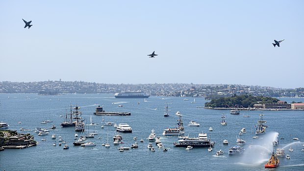 Aircraft conduct a flypast over Sydney Harbour during Australia Day 2019.