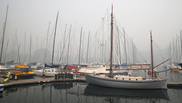 Smoke on the water: Thick haze hangs over the dock at the Cruising Yacht Club of Australia after the cancellation of the Big Boat Challenge.