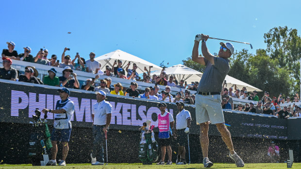 Phil Mickelson tees off on the party hole.