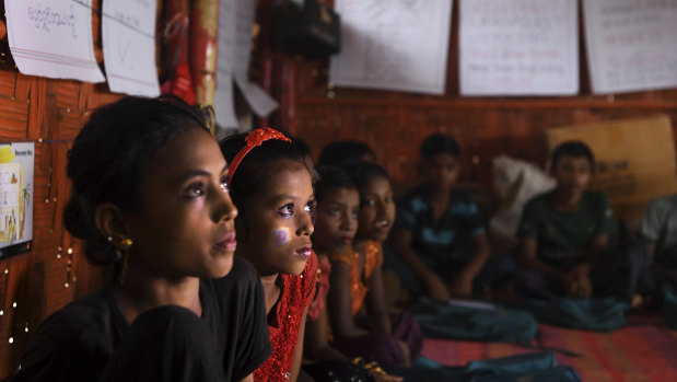 Students during a class at a UNICEF learning centre in Hakim Para camp in 2018. Rohingya refugee children attend the learning centres for two hours a day where they learn English, maths and other subjects.
