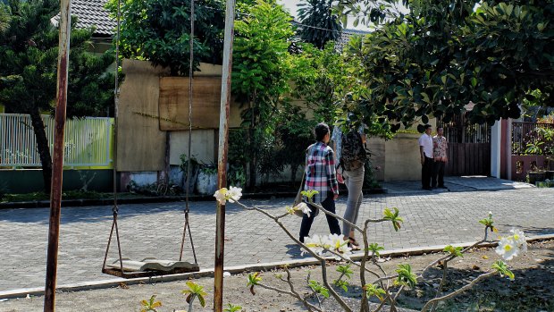 The boarded-up home of Dita Oeprianto's family in the Wonorejo Asri neighbourhood of Surabaya.