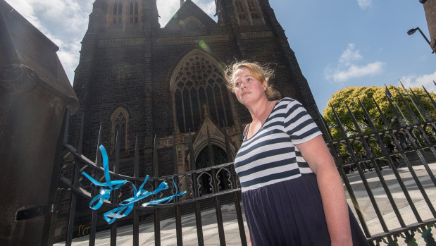 Heather Ryan tied ribbons to the gates of St Patrick's Catherdral in support of victims of sexual abuse by the Catholic Church.