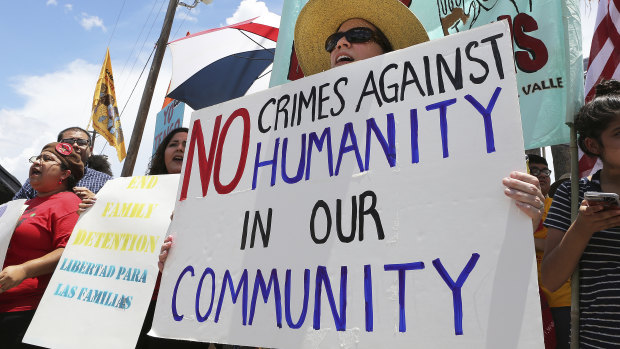 Stefanie Herweck stands with other protesters in front of the US Customs and Border Protection's Rio Grande Valley Sector's Centralised Processing Centre in McAllen, Texas. 