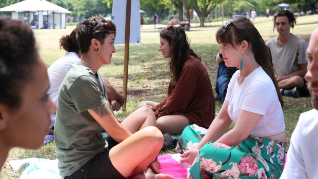 Brisbane residents Emily Nicholls (left) and Sophie Grice are beginning the eye-gazing exercise.
