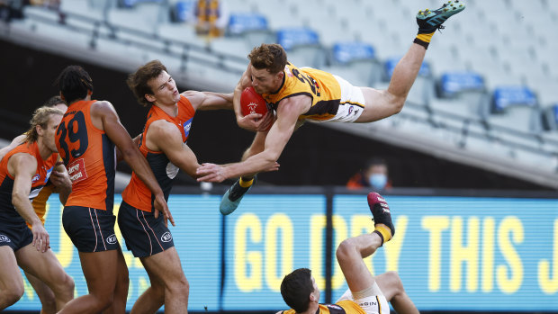 Hawthorn’s Tim O’Brien lands after a spectacular mark at the MCG, the home of Australian sport.