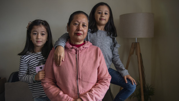 Sabita Shrestha with her grandchildren Ira, 4, and Eva, 7, at their Merrylands home.