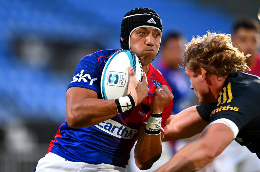 Moana Pasifika’s Christian Leali’ifano takes on the Hurricanes.